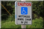 Let op; Gemotoriseerde rolstoel in gebruik